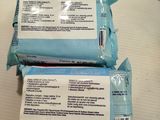two packages of wipes sitting on a table