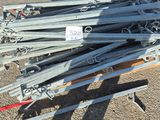 a pile of skis and ski poles on a pallet