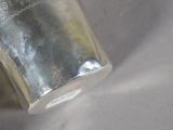 a silver cup that is sitting on a table