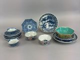 a lot of blue and white plates and bowls