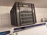 a white refrigerator in a kitchen with a microwave on top of it