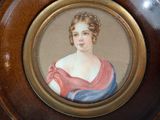 a picture of a woman in a pink dress on a plate
