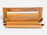 a wooden bench that is sitting on a white surface