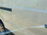 a white van that is parked on the side of the road