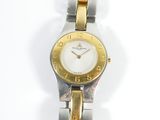 an image of a close up of a wrist watch on a white surface