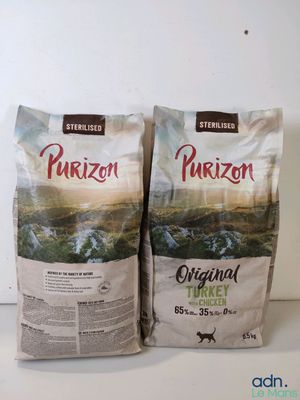 two bags of purizon dog food sitting on a counter