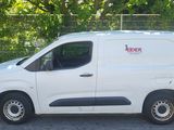 a white van that is parked in a parking lot