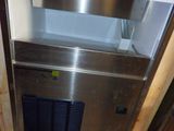 an image of a stainless steel refrigerator in a kitchen