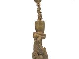 an image of a statue of a person with a hat on it ' s head