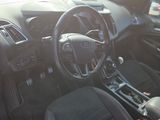 a car with a steering wheel and a dash board
