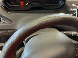 a close up of a steering wheel in a car