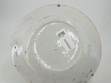 a white plate that has a black and white design on it