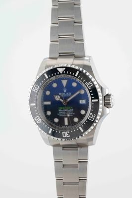 rolex submarine watch with blue dial and black bezel