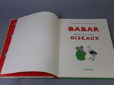 an open book with a picture of a cartoon character on it
