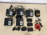 many different types of batteries and power cords laid out on a table