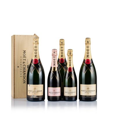 a group of three bottles of champagne in front of a wooden box