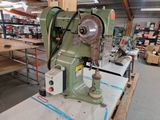 a machine that is sitting on a table in a warehouse