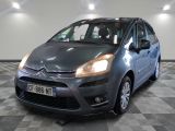 the grey citrole is parked on a checkered tile floor
