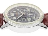 a close up of a wrist watch with a brown strap