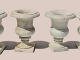 three vases sitting next to each other on a table