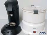 a coffee maker next to a blender on a counter
