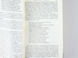 someone is holding a book open to a page with a picture on it