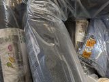 many bags of baby clothes wrapped in plastic