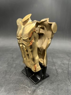 brass statue of a horse with a saddle on a black base