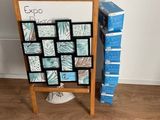 a wooden easer with a bunch of pictures on it
