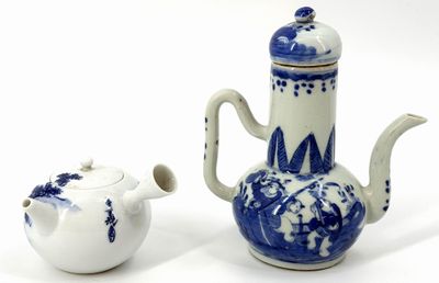 a blue and white tea pot and a white tea pot