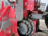 a tractor that is parked in a barn