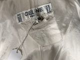 someone is holding a white shirt with a tag on it
