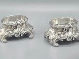 pair of antique silverplated candlesticks with floral designs