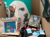 a cardboard box filled with toys and books in a store