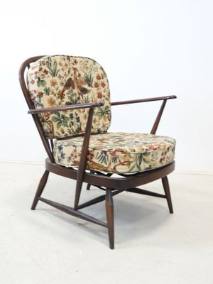 an image of a chair with a floral upholstered seat