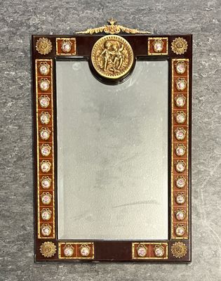 a picture of a mirror with a picture of a man on it