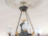 a chandelier hanging from the ceiling in a room