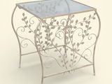une table en verre avec un cadre en métal et un plateau en verre