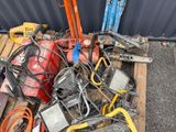 a pile of assorted electrical equipment on a pallet
