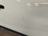 the door handle of a white car with a black handle