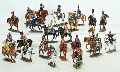 many figurines of men riding horses and horses