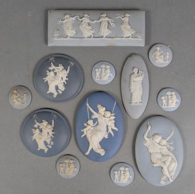 a lot of white and blue cameos on a table