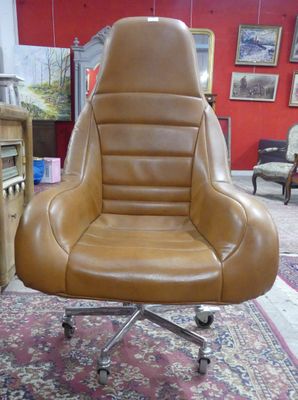 a brown office chair that is sitting on a rug