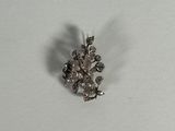 a small piece of jewelry that is laying on a table