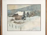 framed watercolor painting of a snowy landscape with a barn in the distance