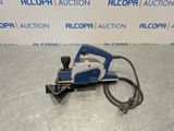 a blue and white planer sitting on top of a metal surface