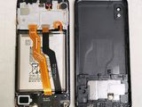 a picture of a cell phone with a broken battery