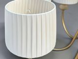 two lamps that are sitting on a table