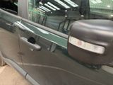 an image of a side view of a car with the door open