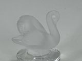 clear glass figurine of a swan on a clear base